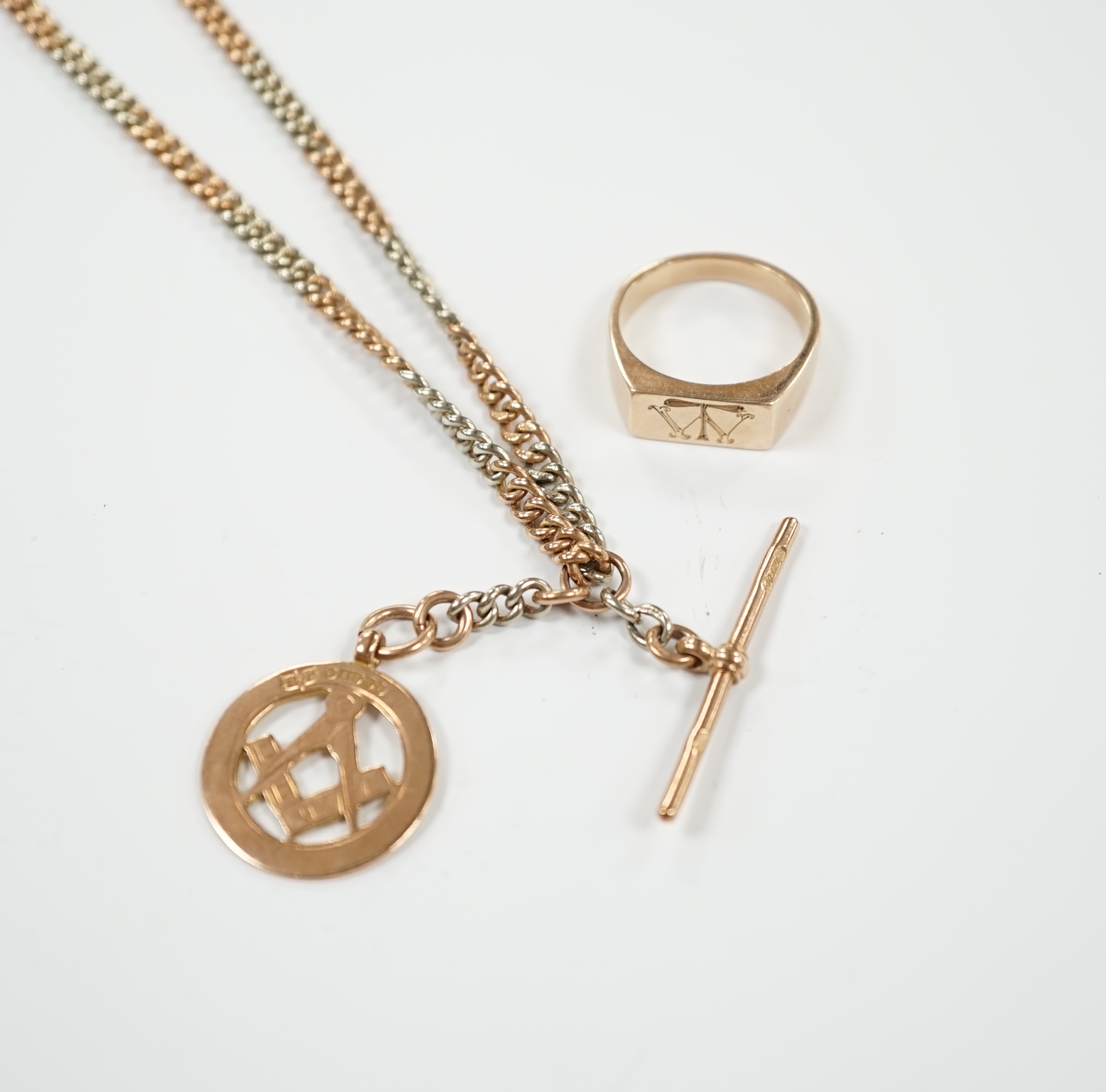 A two colour 9ct gold albert, 40cm, hung with a 9ct gold masonic medal, together with a 9ct masonic ring, gross weight 36.9 grams.